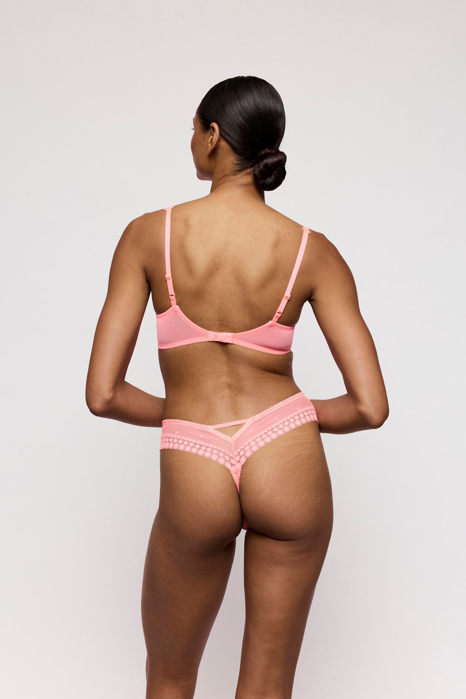Marie Jo Annaelle Balcony Bra styled on model in Neon Peach