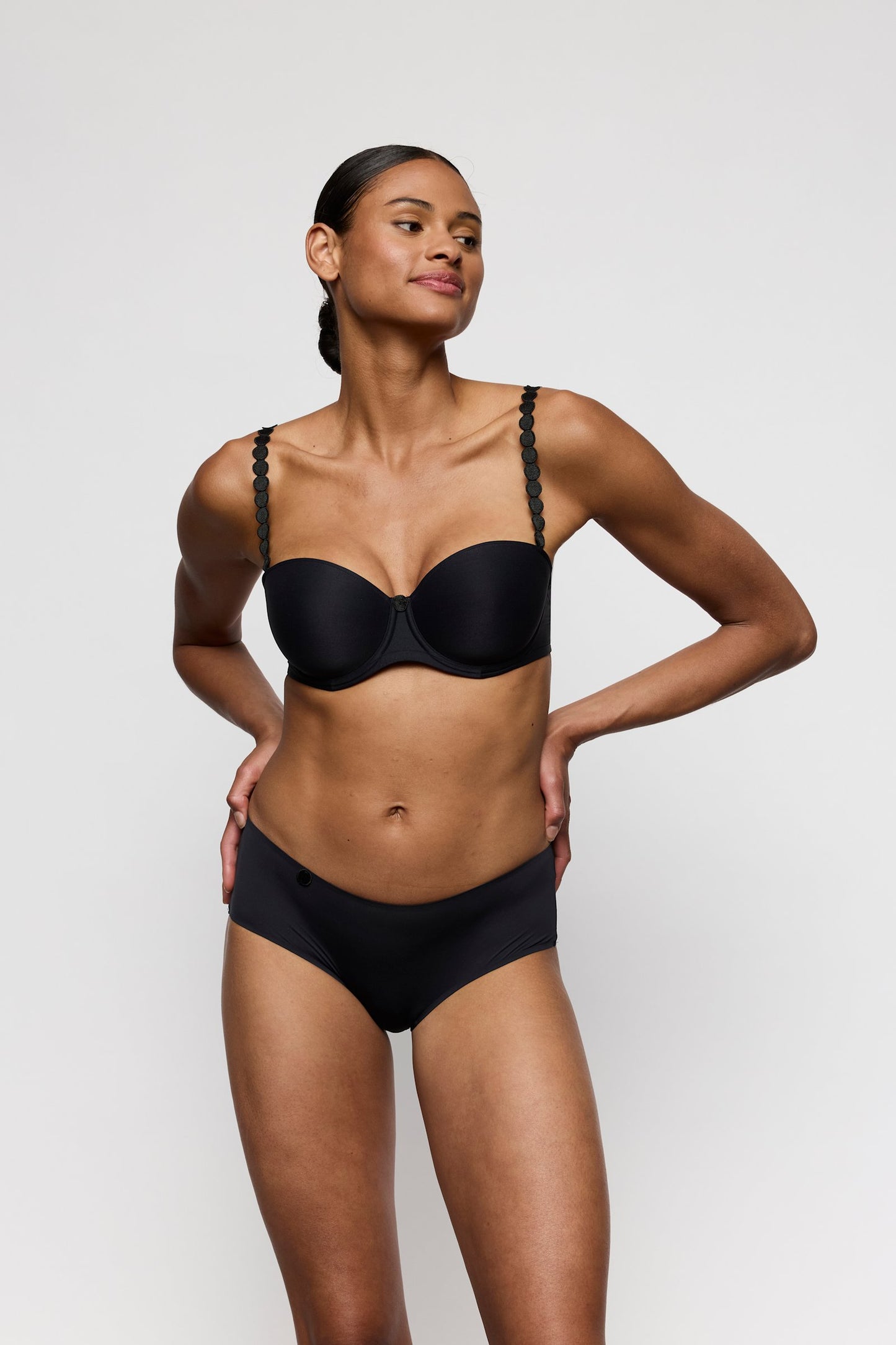Marie Jo Tom Strapless Bra styled on model in Charcoal