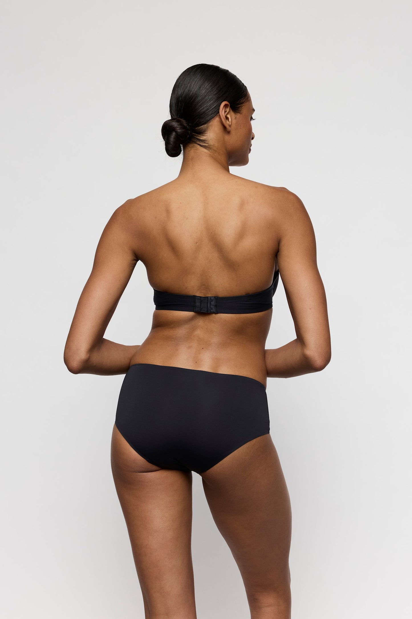 Marie Jo Tom Strapless Bra styled on model in Charcoal