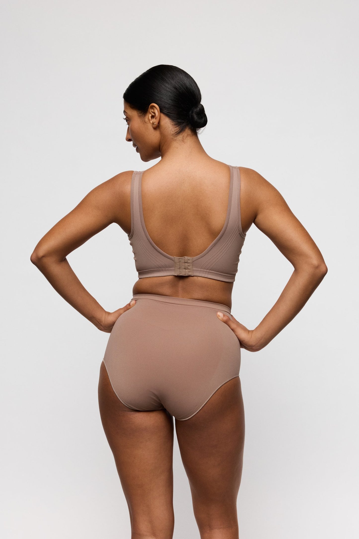 PrimaDonna Nudda Shapewear High Brief on model in Ginger