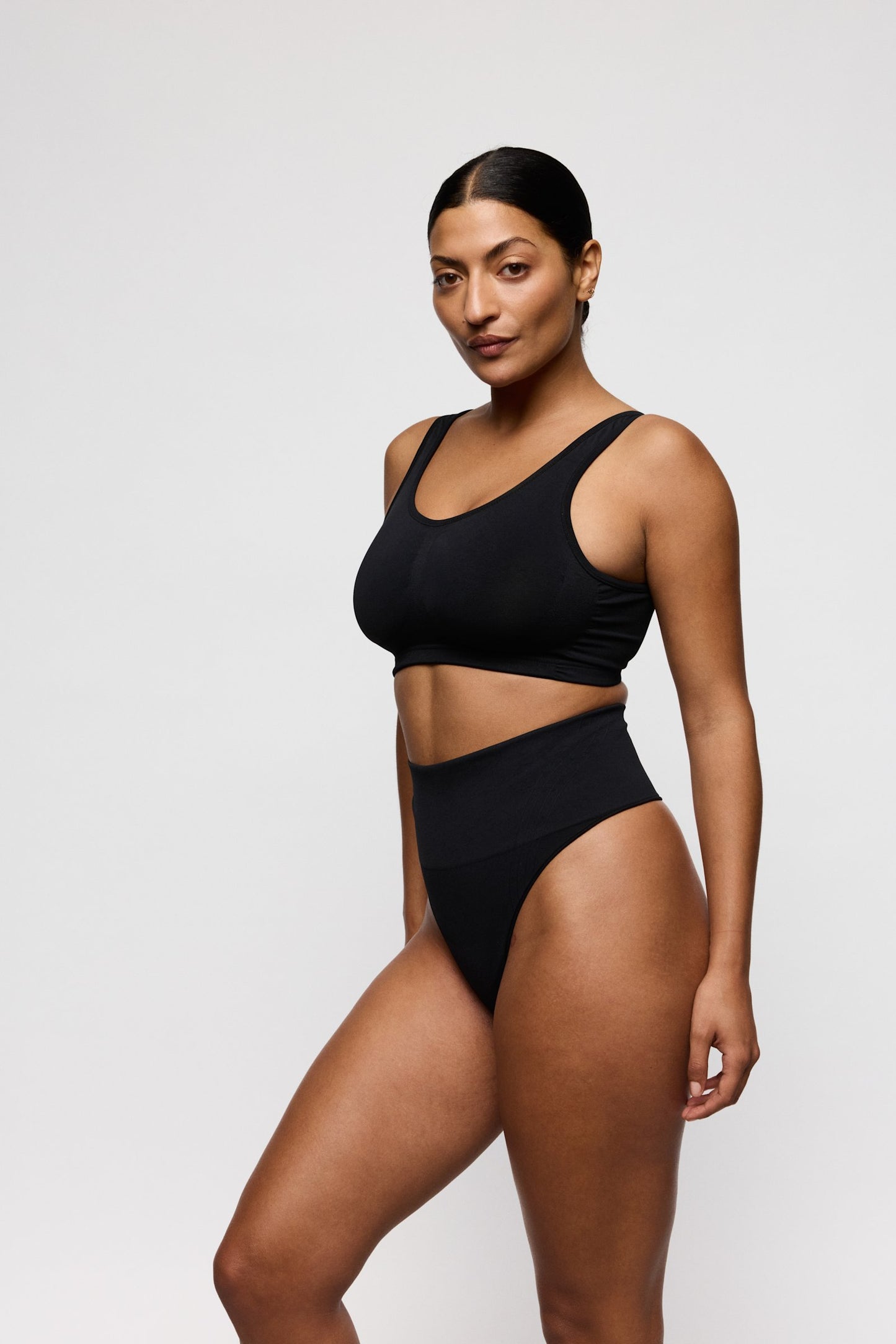 PrimaDonna Nudda Shapewear Thong on model in Black