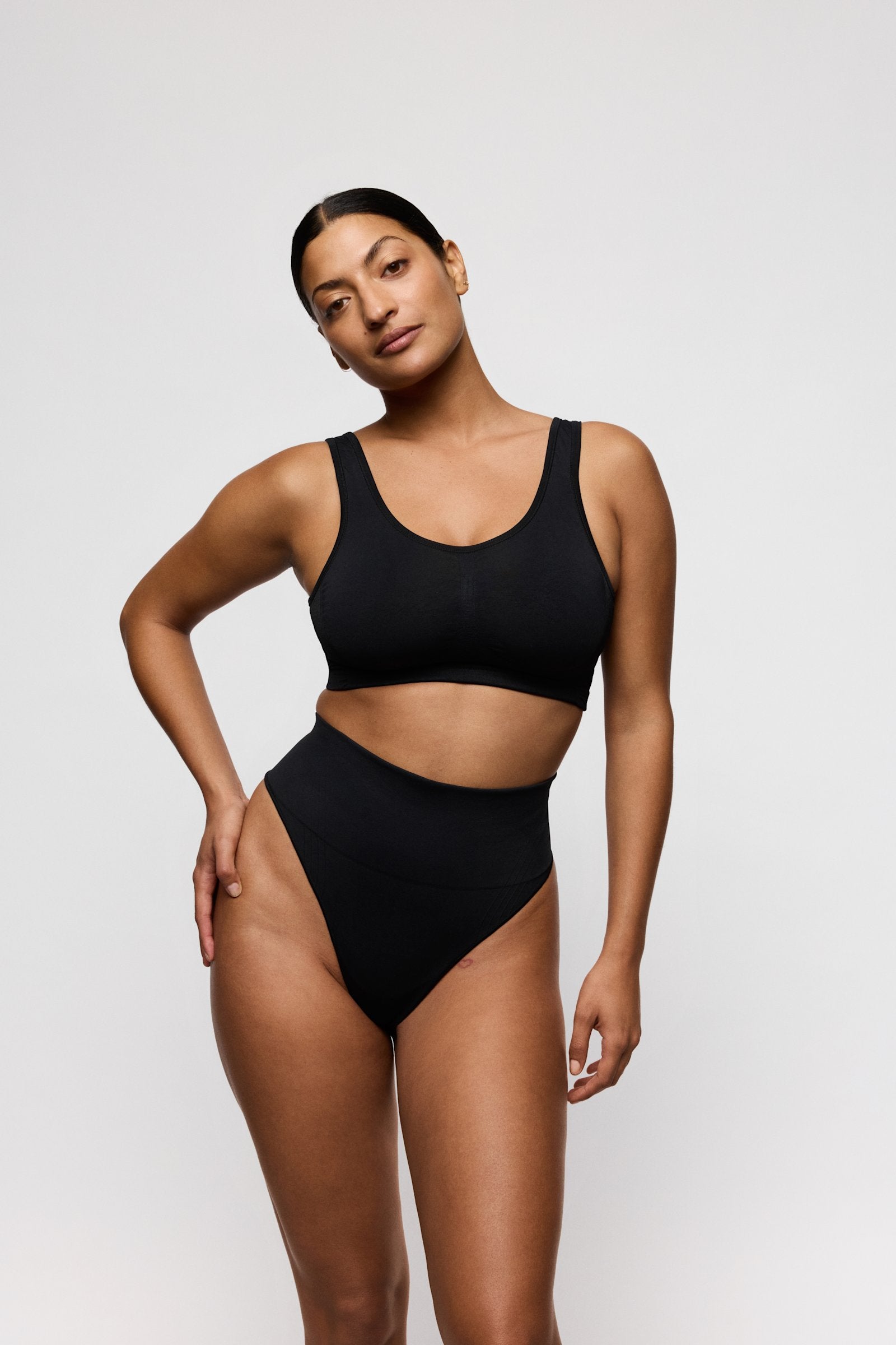PrimaDonna Nudda Shapewear Thong on model in Black