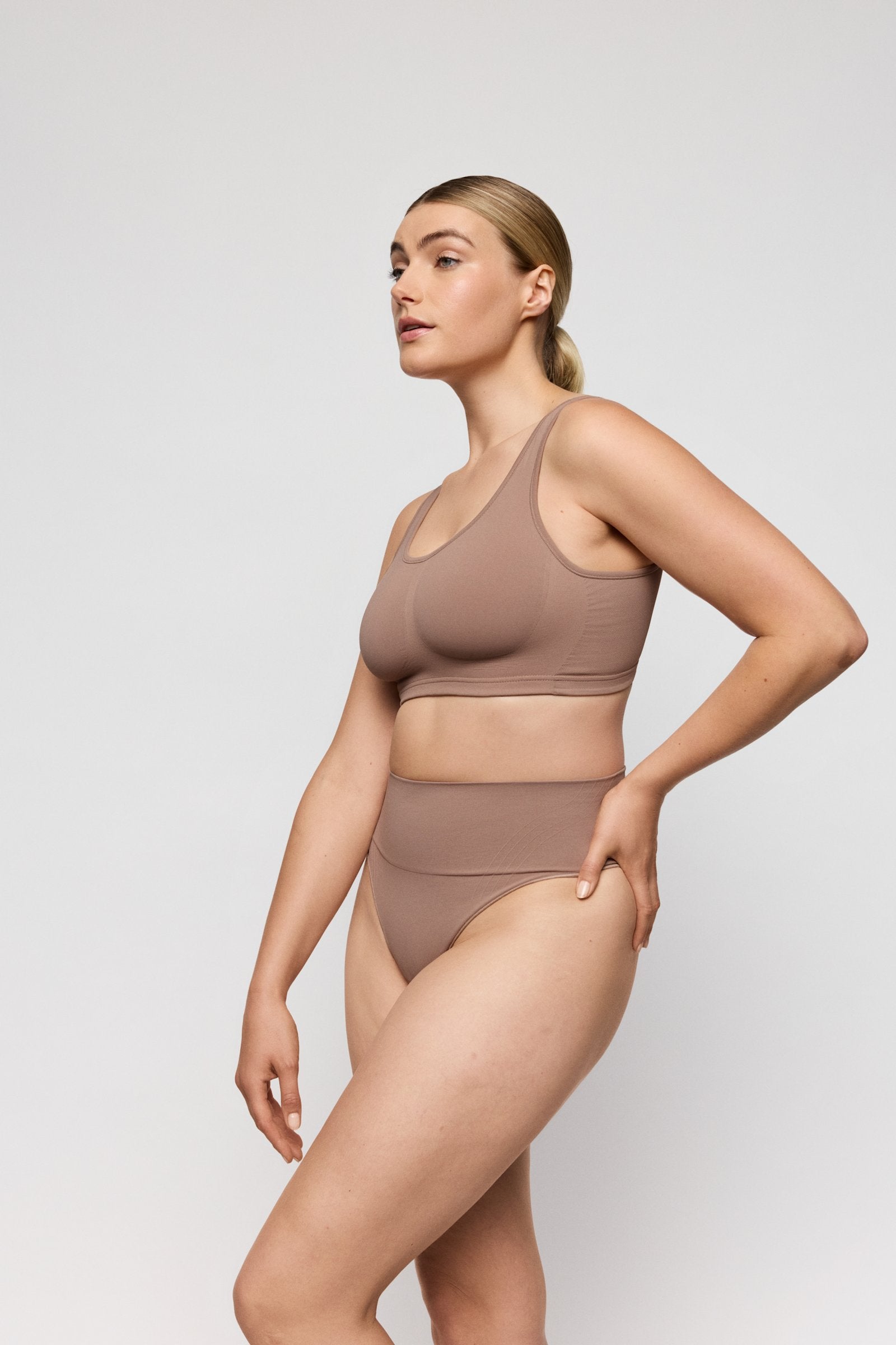 PrimaDonna Nudda Shapewear Thong on model in Ginger
