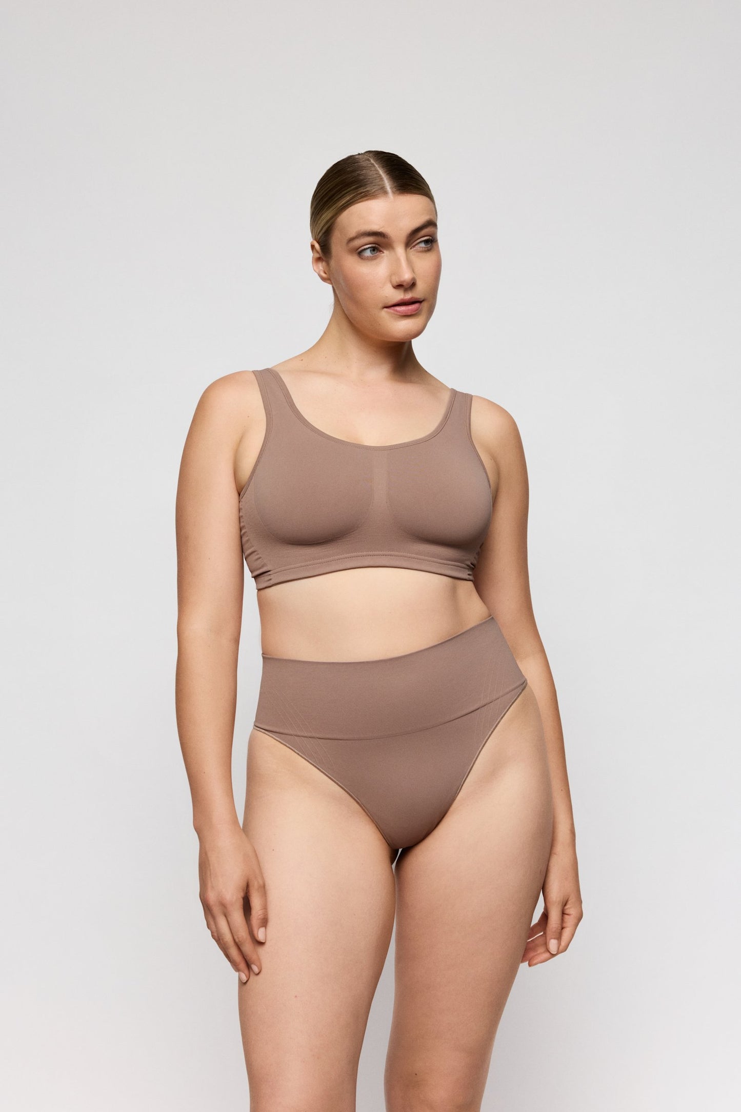 PrimaDonna Nudda Shapewear Thong on model in Ginger