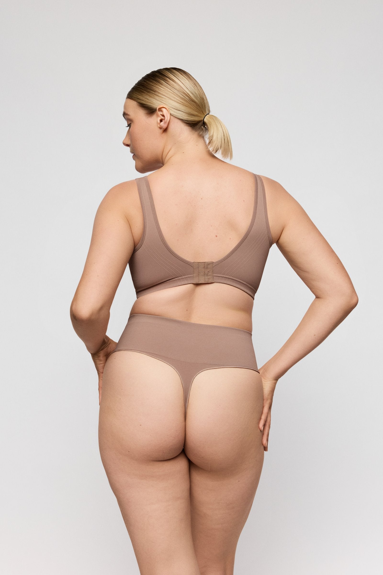 PrimaDonna Nudda Shapewear Thong on model in Ginger