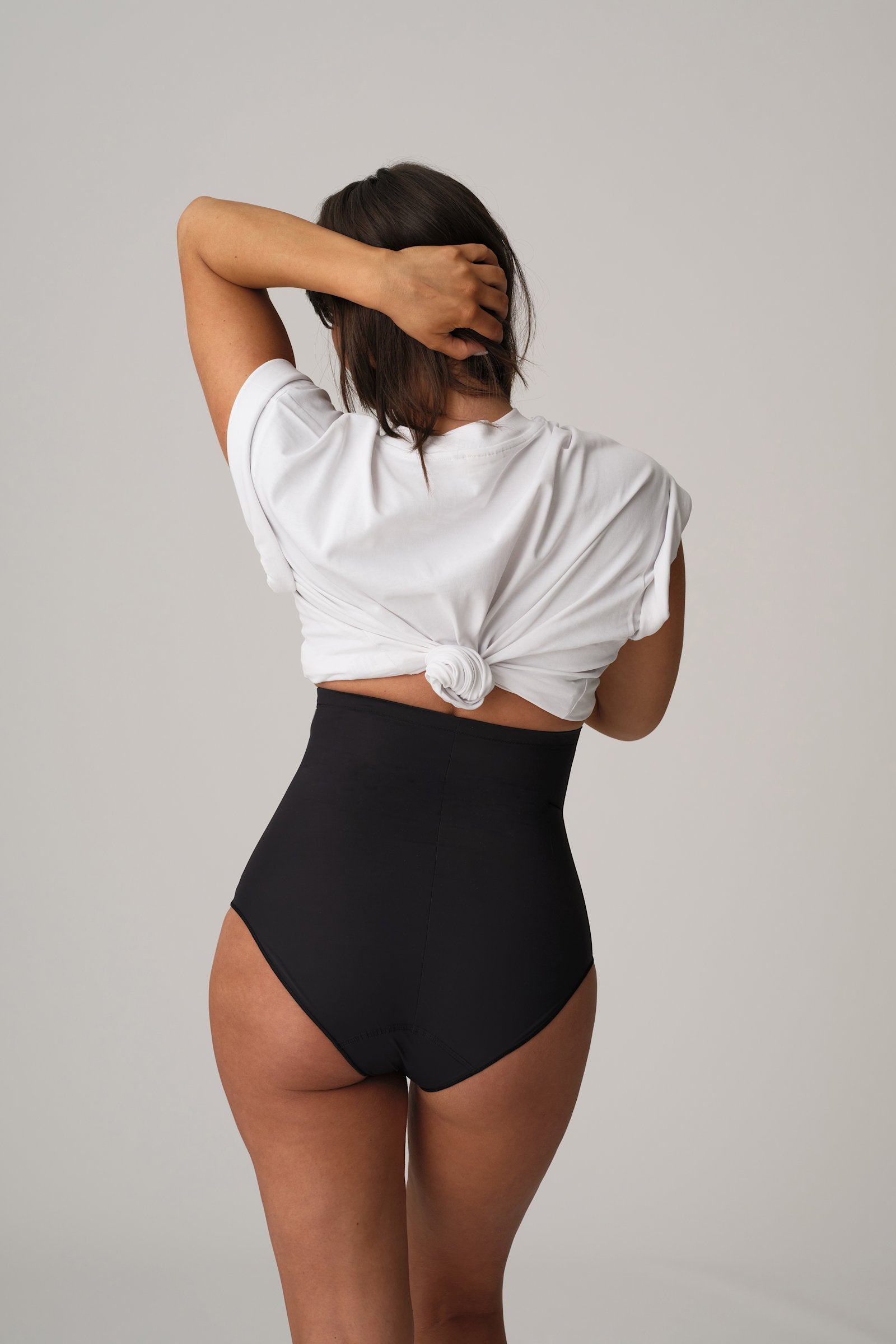 PrimaDonna Perle Shapewear High Brief on model in Charcoal