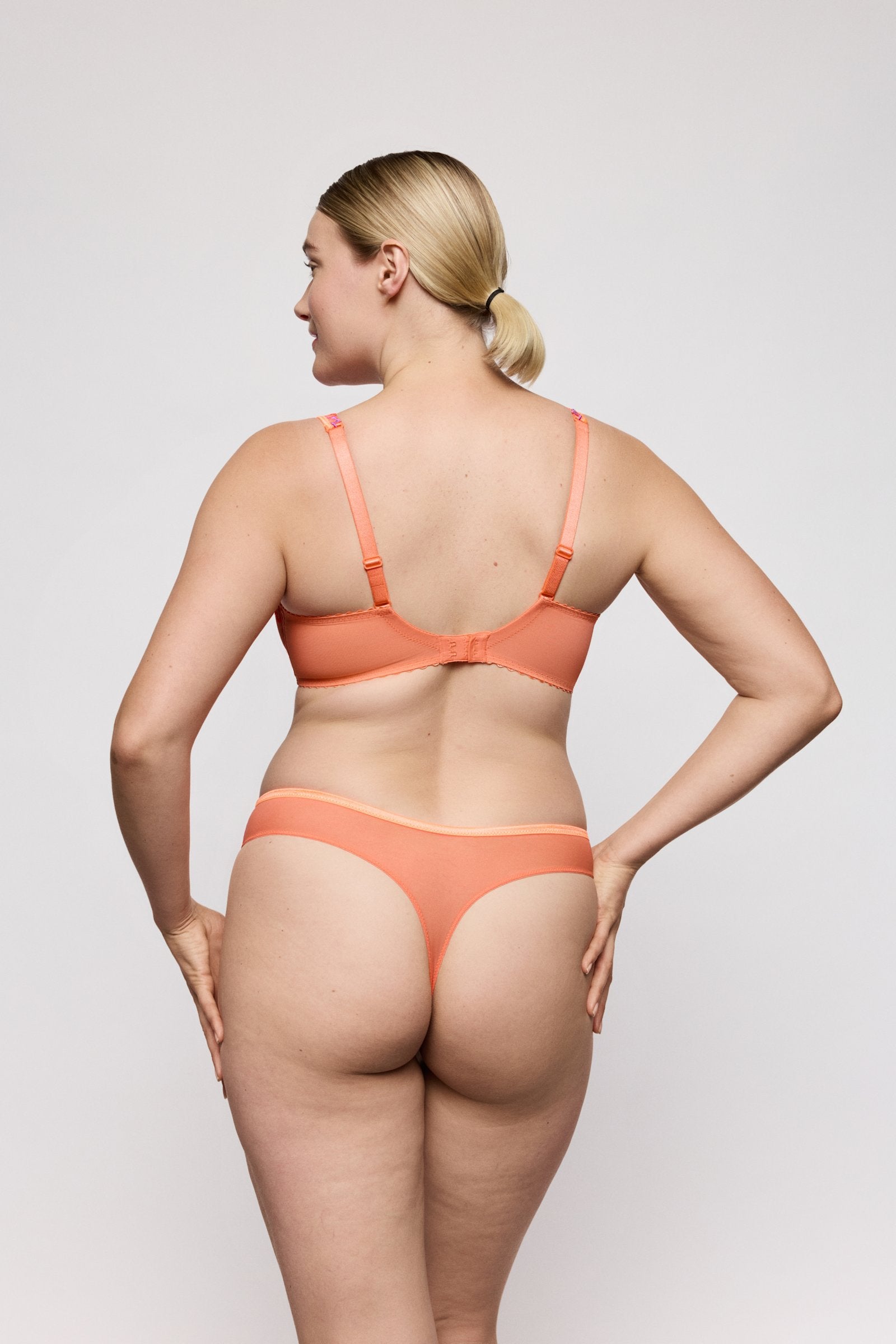 PrimaDonna Devdaha Thong on model in Sunset Blush