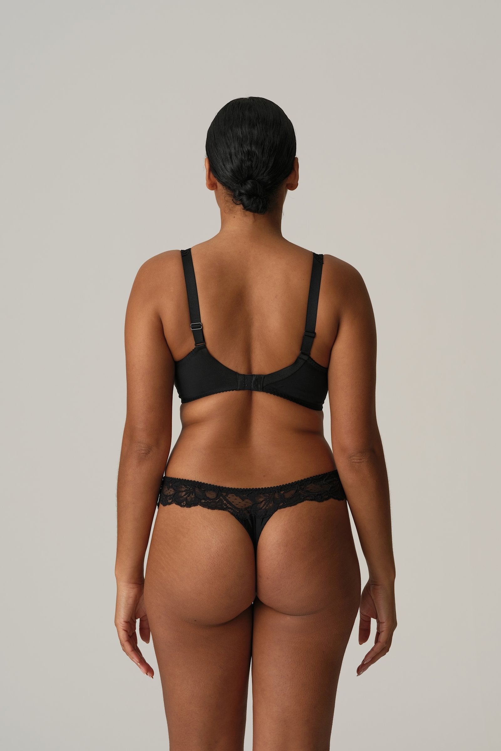 PrimaDonna Madison Thong on model in Black Tailor